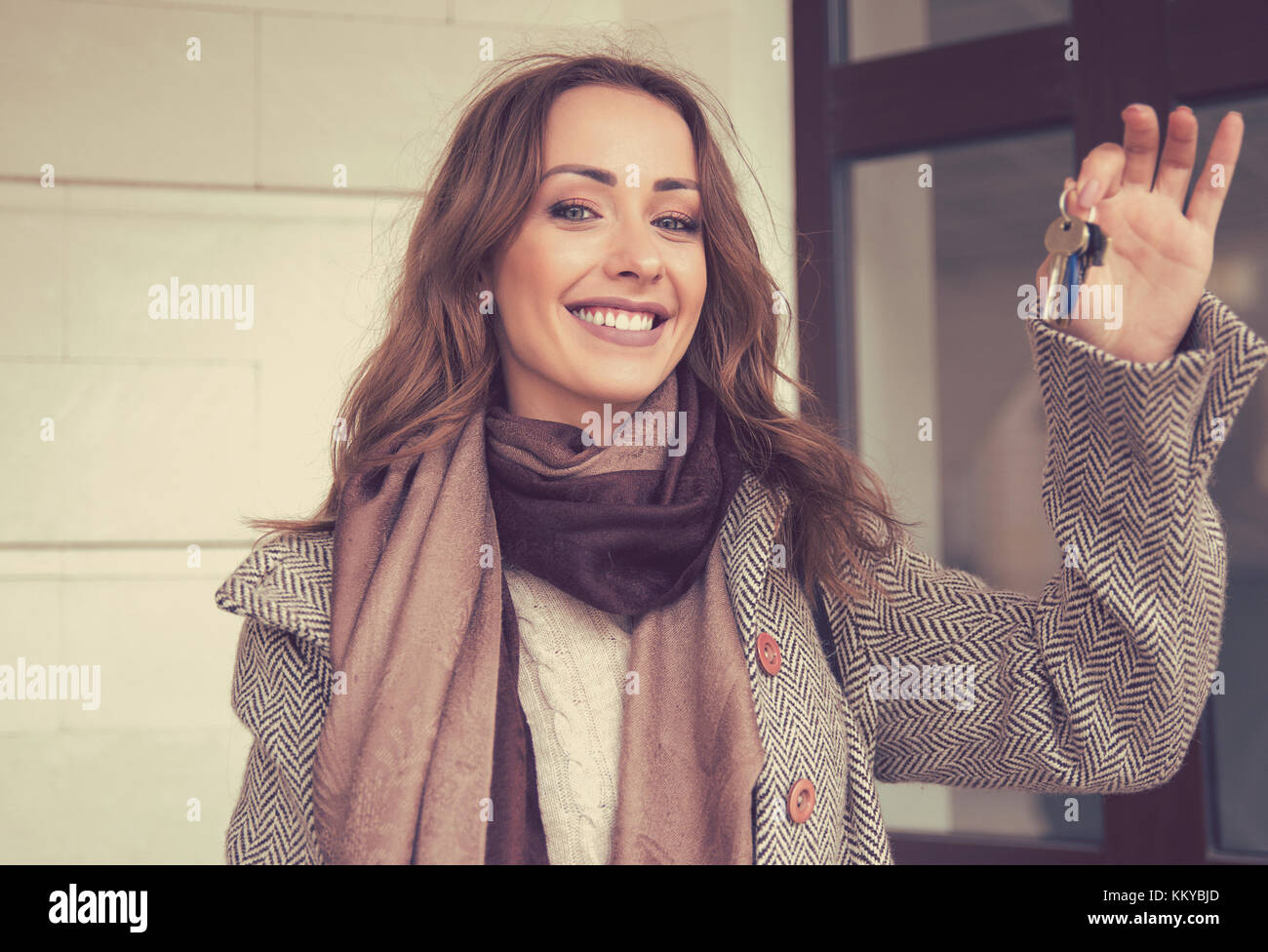 Happy beautiful woman holding keys from her new apartment Stock Photo ...