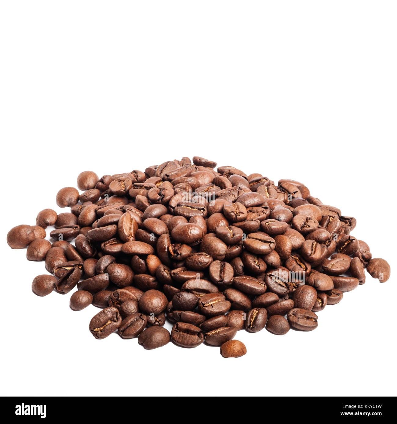 A pile of roasted coffee beans on a white background Stock Photo - Alamy