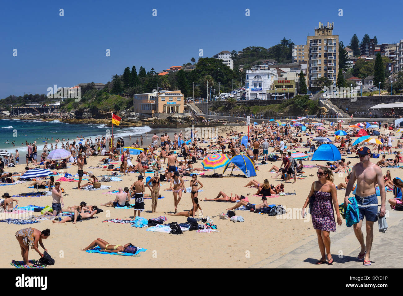 Sunbathers on Coogee Beach, Coogee, an eastern suburb of Sydney, New South Wales, Australia Stock Photo
