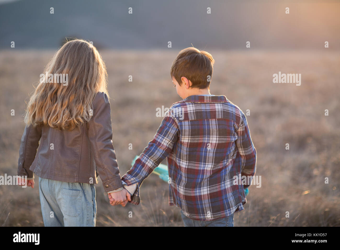 Boy And Girl Running Into The Sunset And Holding Hands High Resolution Stock Photography And Images Alamy Boy And Girl Running Into The Sunset And Holding Hands High Resolution Stock Photography And Images Alamy