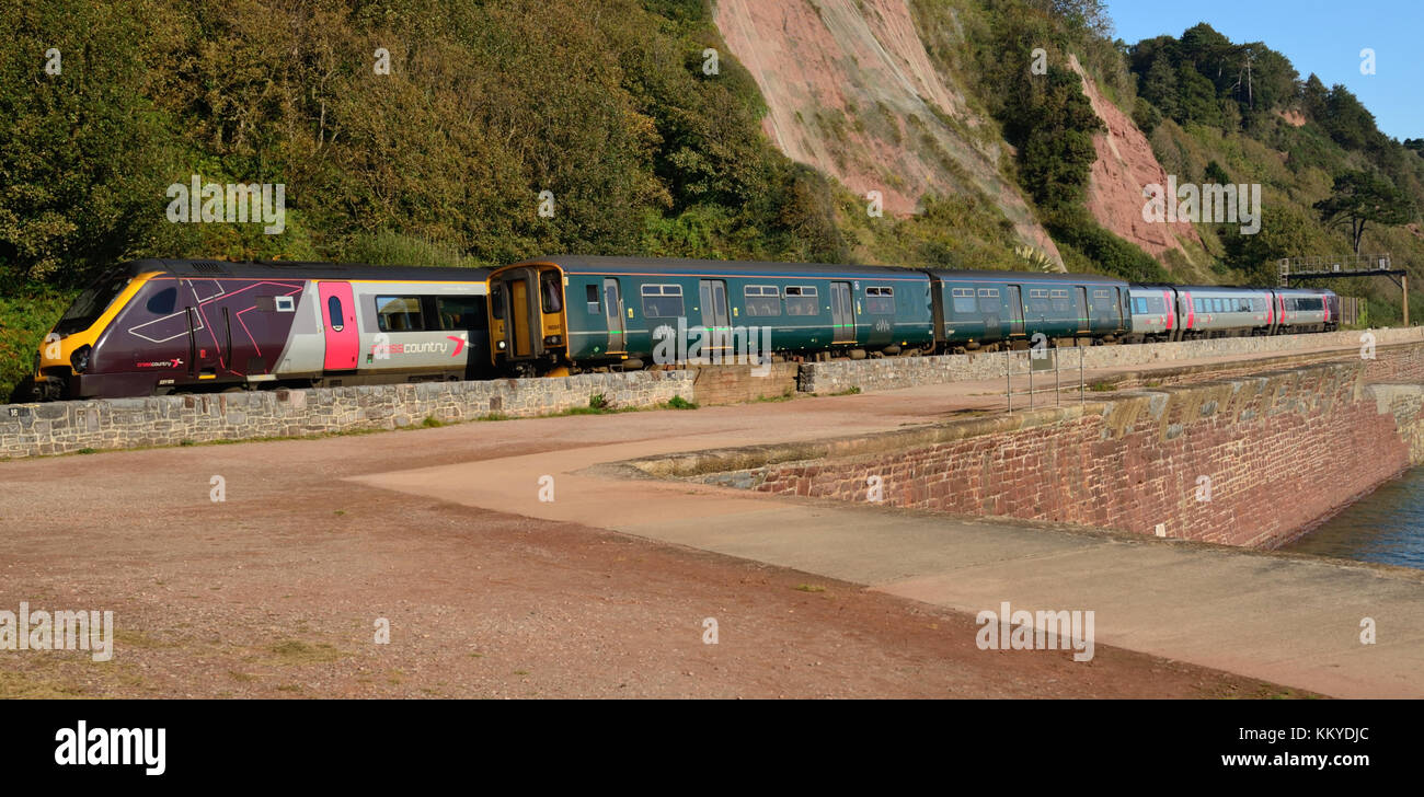 A GWR local train and a Cross Country train passing each other at Sprey Point., Teignmouth. Stock Photo