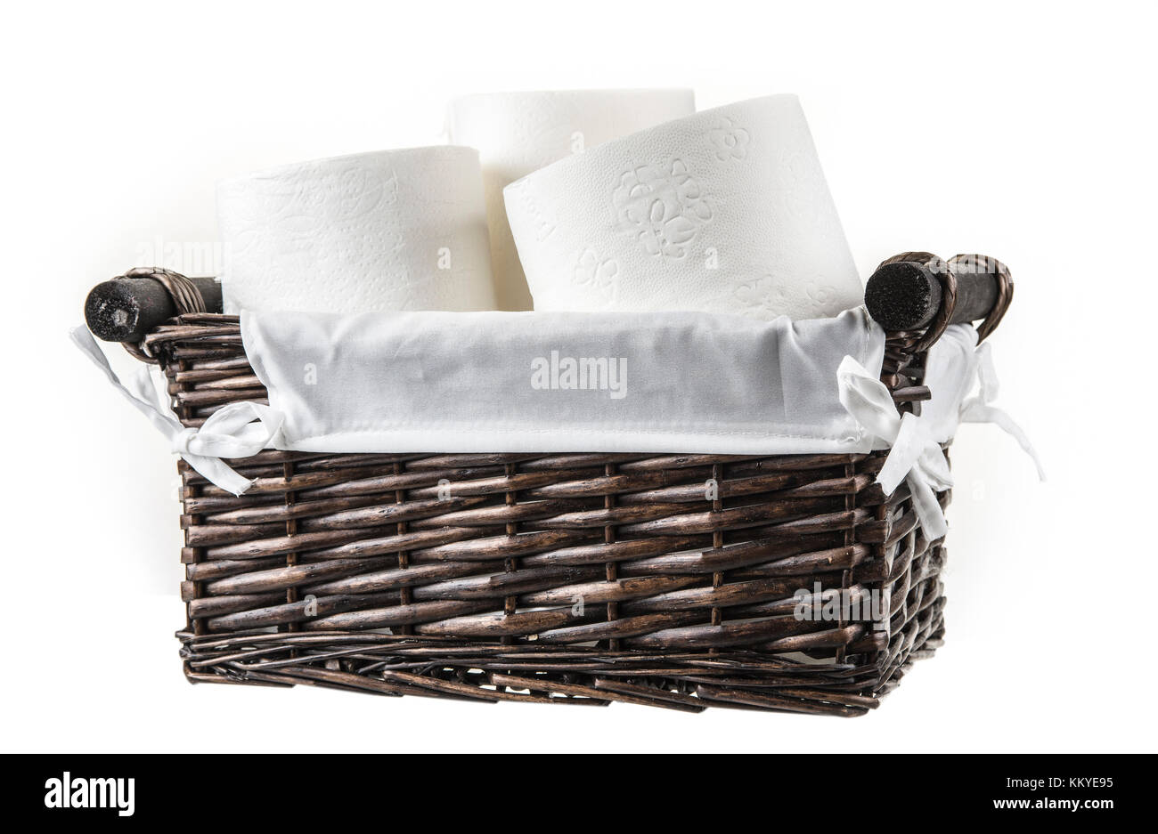 Basket full of toilet paper on the white background Stock Photo