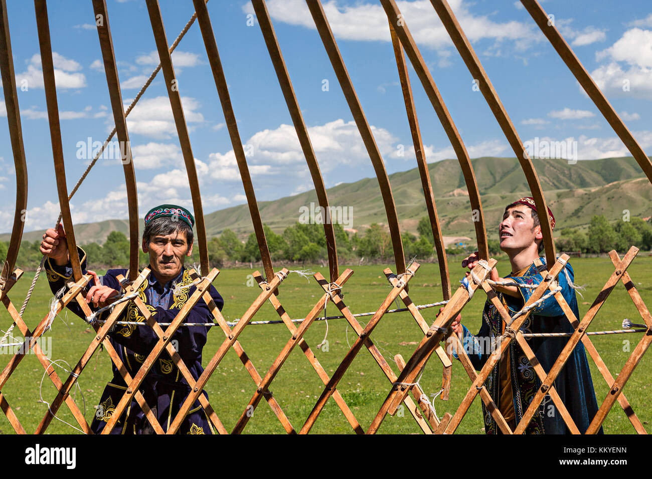Kazakh people building a nomadic tent known as yurt, in Saty Village, Kazakhstan. Stock Photo