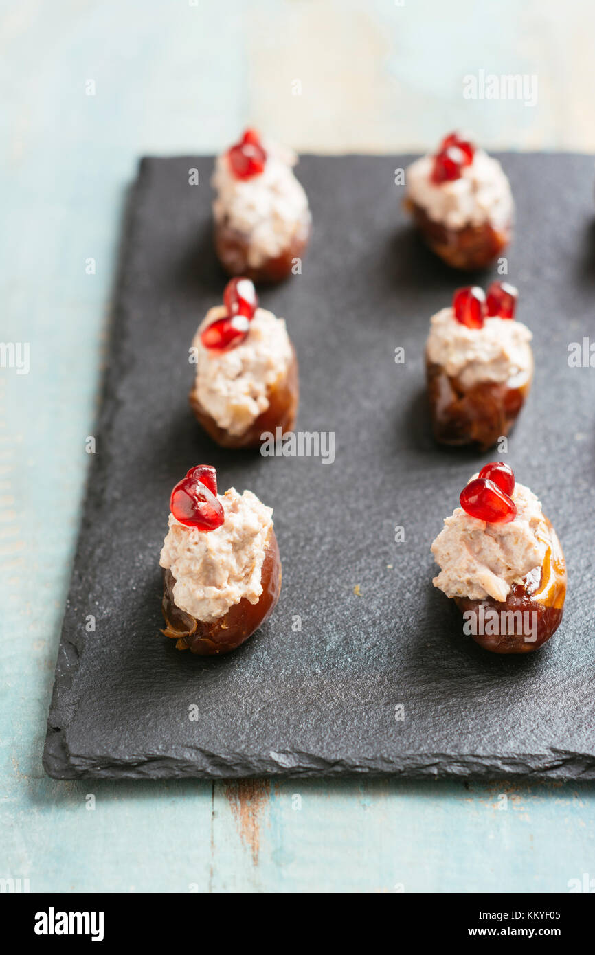 Walnut and Vegan Cream Cheese Filled Dates Stock Photo Alamy