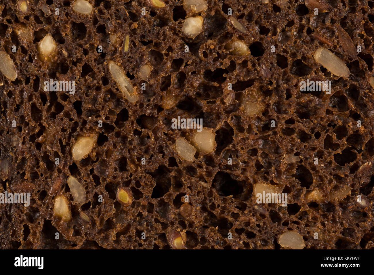 Dark rye bread with sunflower seeds closeup for background Stock Photo
