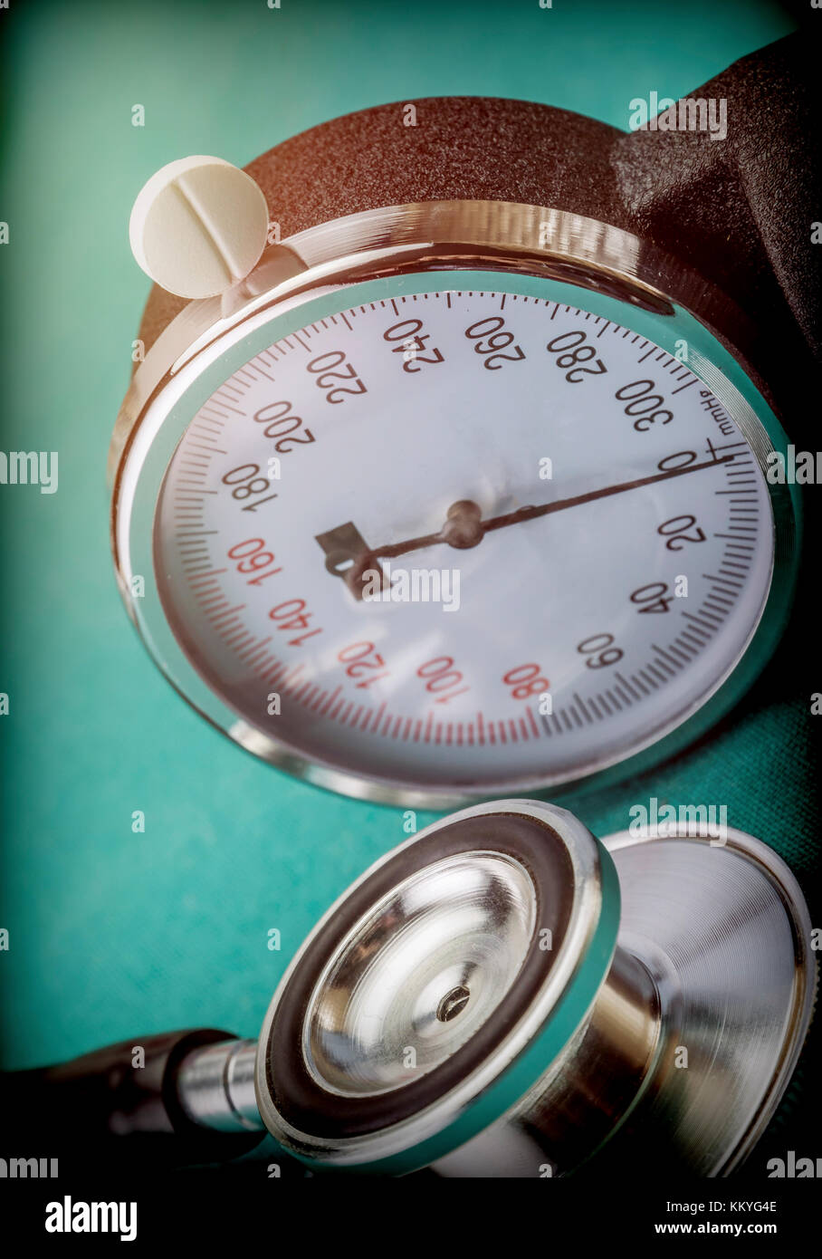 White pad next to a manometer to measure blood pressure and a