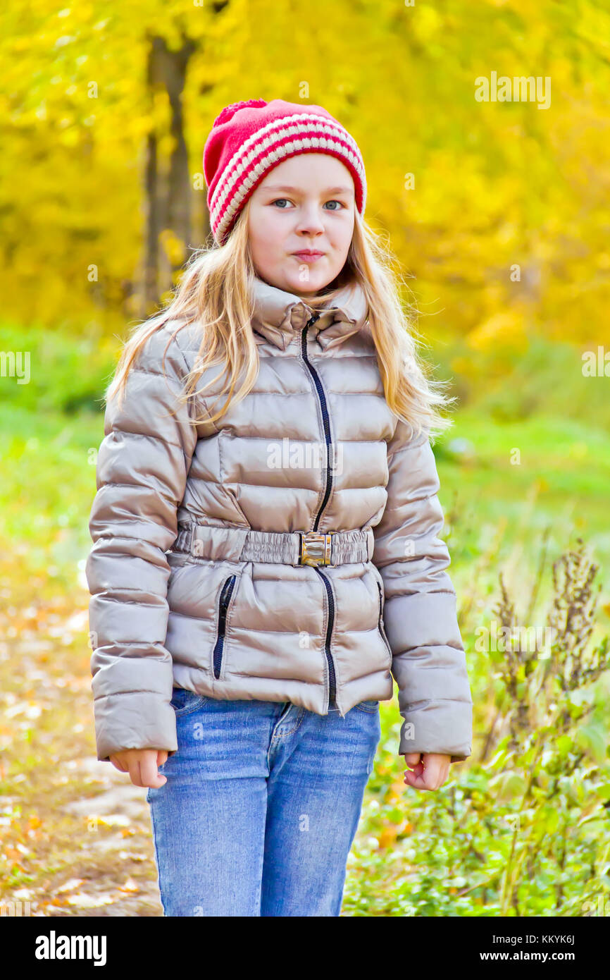 Photo of cute smiling girl in autumn Stock Photo - Alamy