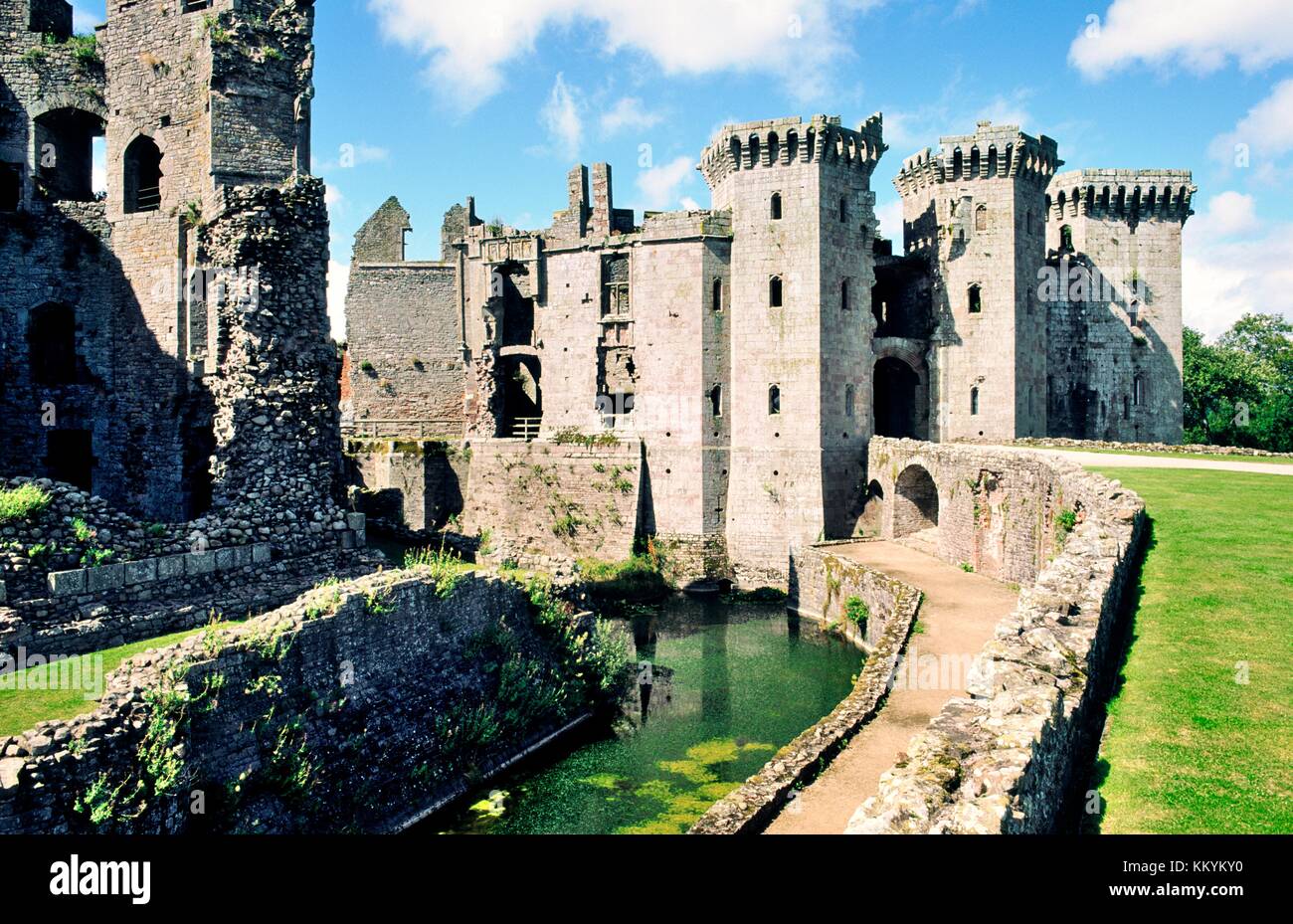 Raglan Castle near Monmouth in Gwent, east Wales, UK showing the moat, walls and entrance towers Stock Photo