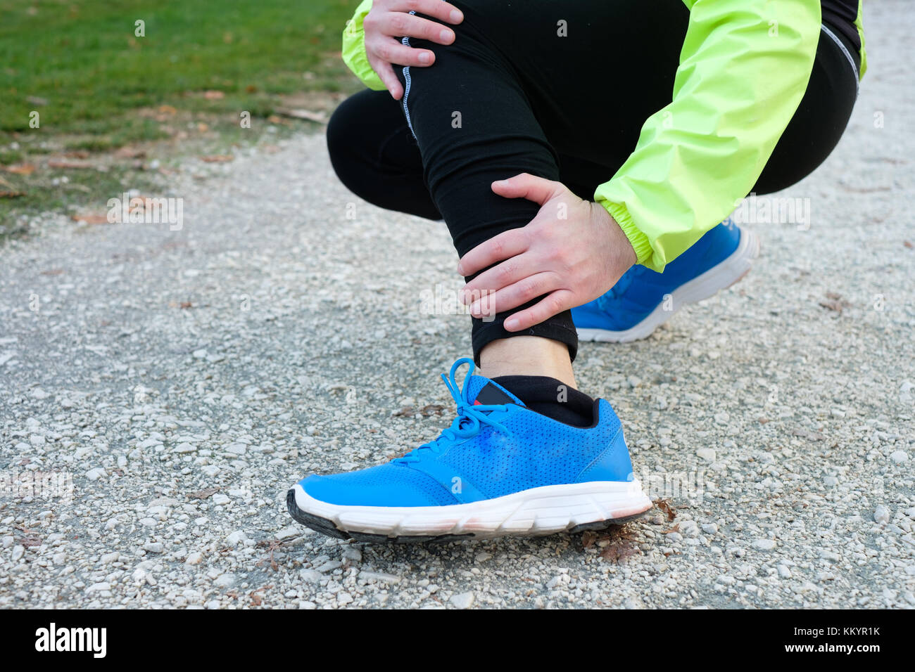 Injury running concept . Man feeling leg pain while training because