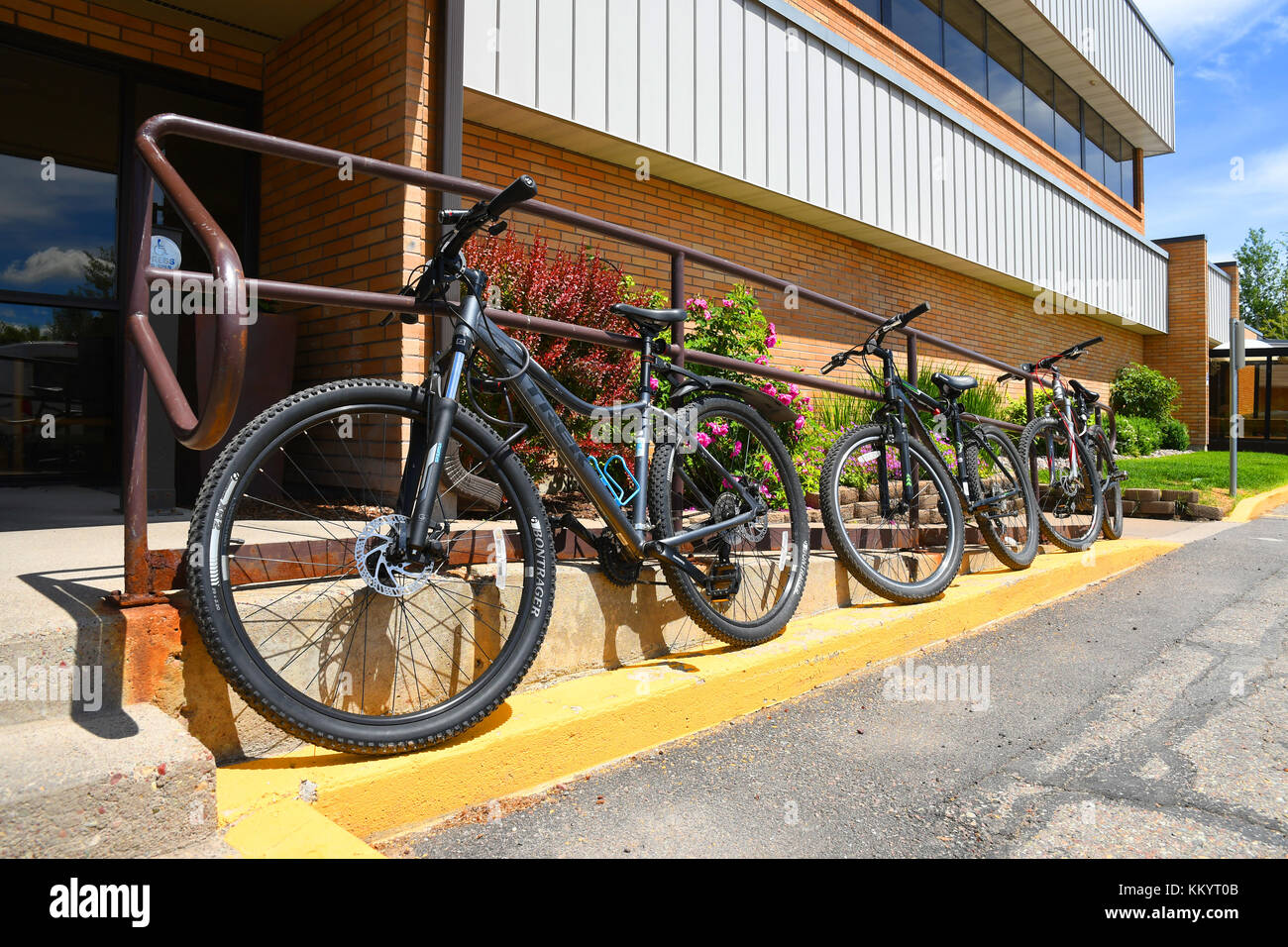 KALISPELL, MONTANA, USA June 21, 2017 Row of mountain bikes locked