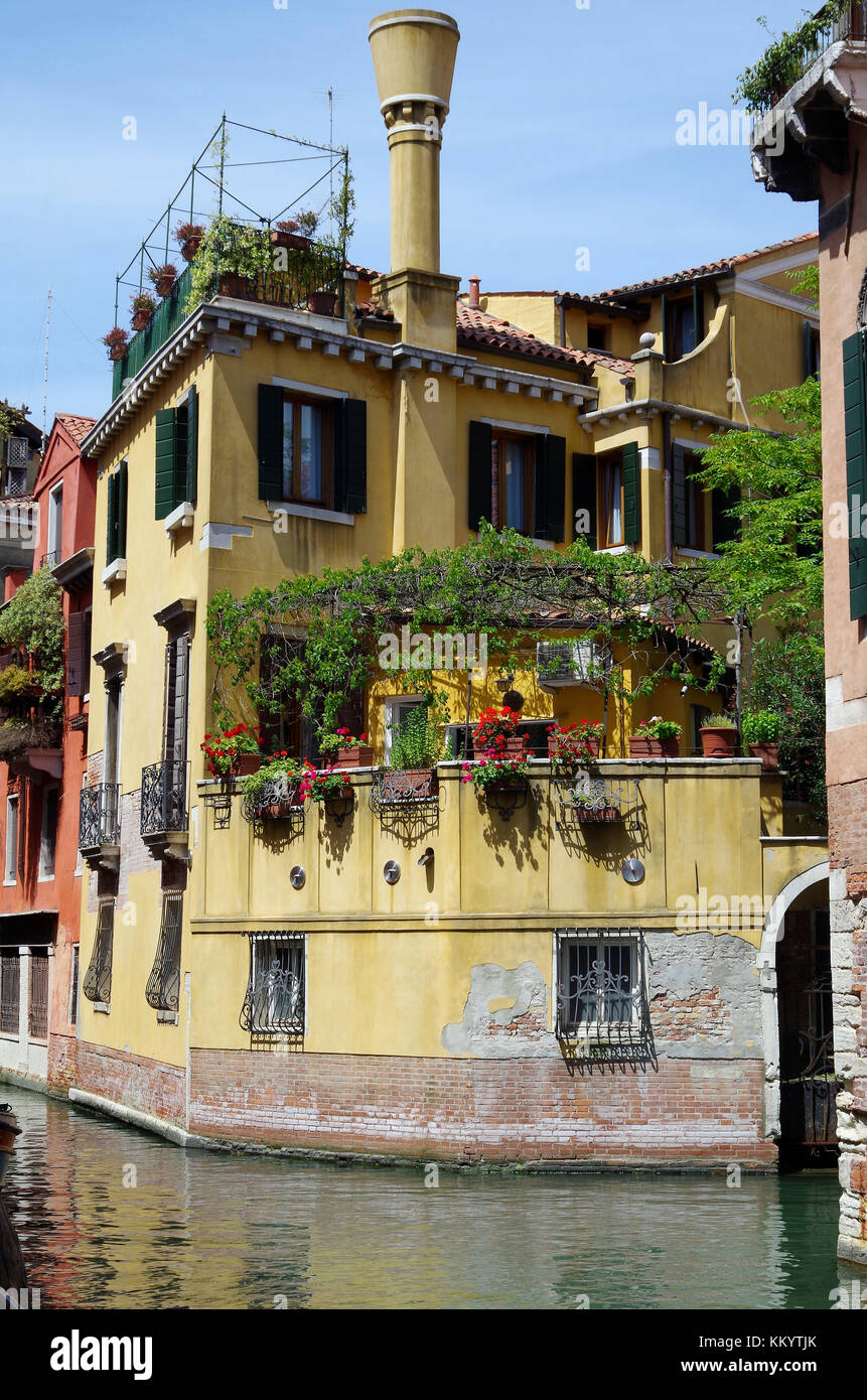Garden and colourful houses, with typical chimney, at junction