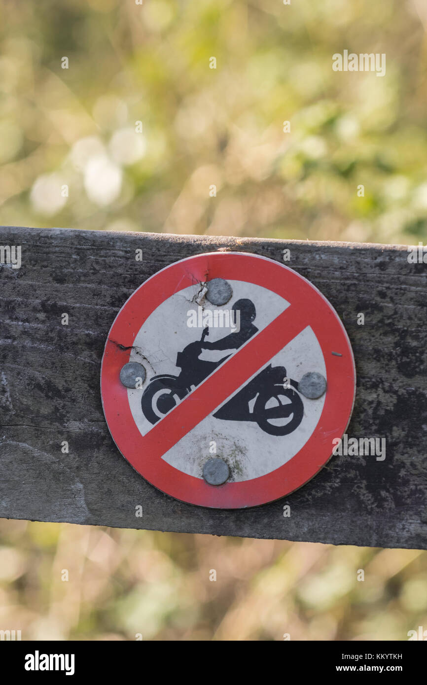 No motorbike access sign on country path in Cornwall, UK. Possible metaphor restricted freedoms, Hells Angels motorbike culture, stay on right path. Stock Photo
