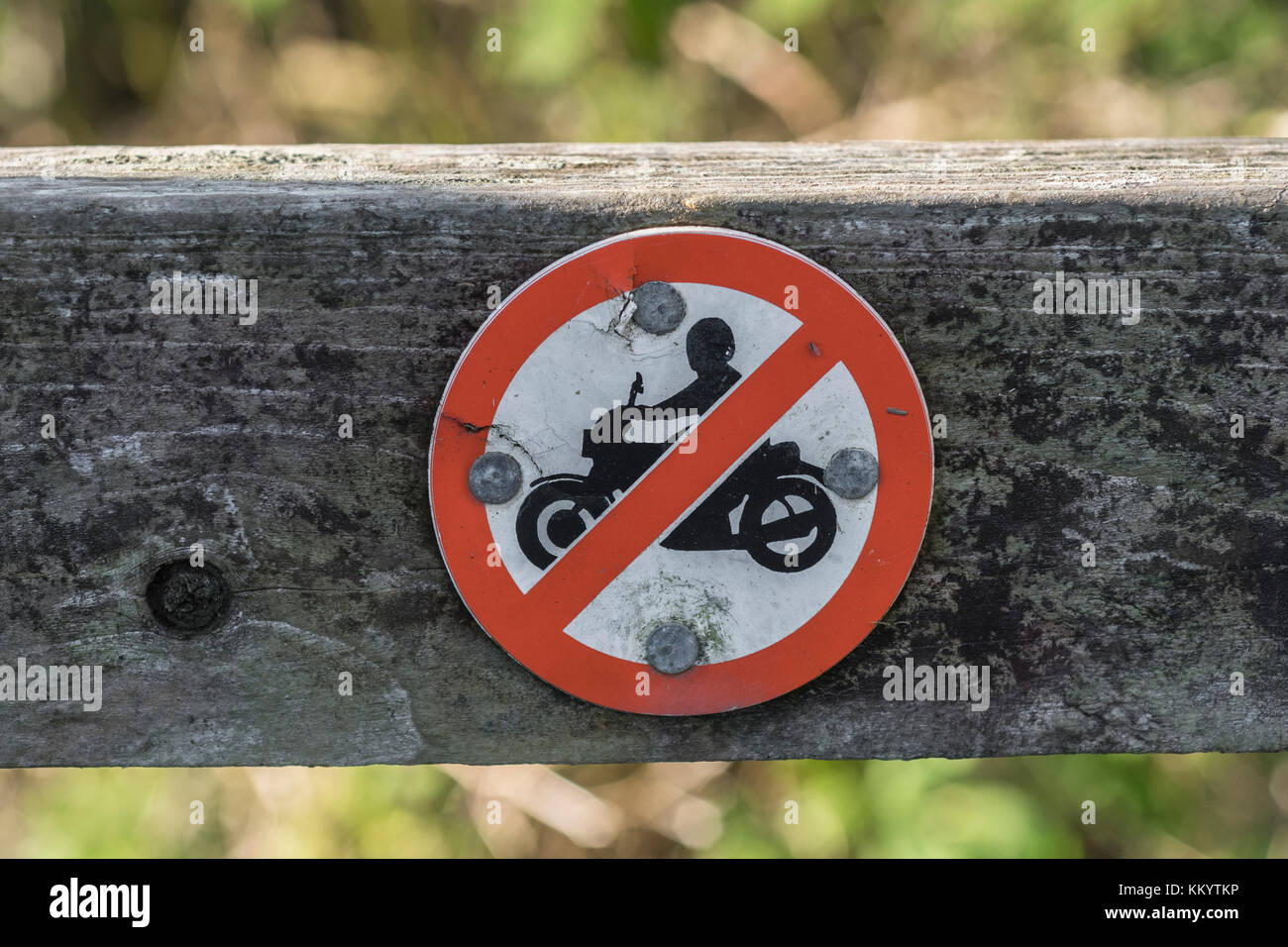 No motorbike access sign on country path in Cornwall, UK. Possible metaphor restricted freedoms, Hells Angels motorbike culture, stay on right path. Stock Photo