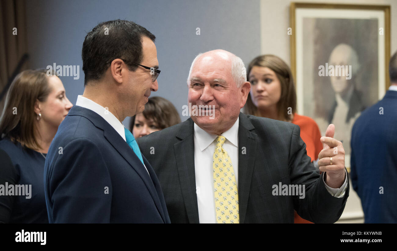 U.S. Treasury Secretary Steven Mnuchin (left) talks to U.S. Agriculture Secretary Sonny Perdue at the U.S. Department of Agriculture Headquarters September 28, 2017 in Washington, DC.  (photo by Lance Cheung via Planetpix) Stock Photo