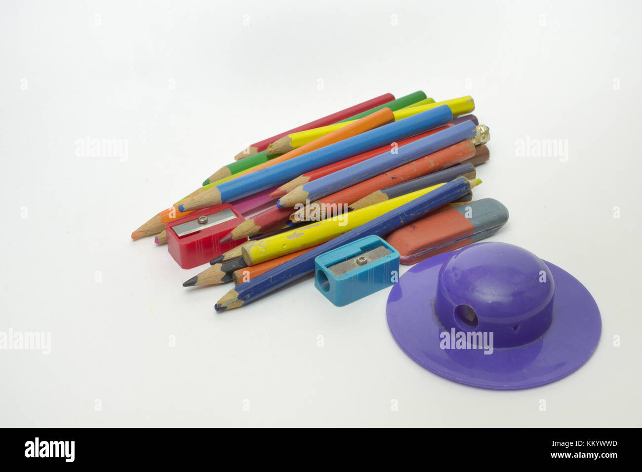 set of old colored pencils, sharpener in the shape of a brimmed hat and