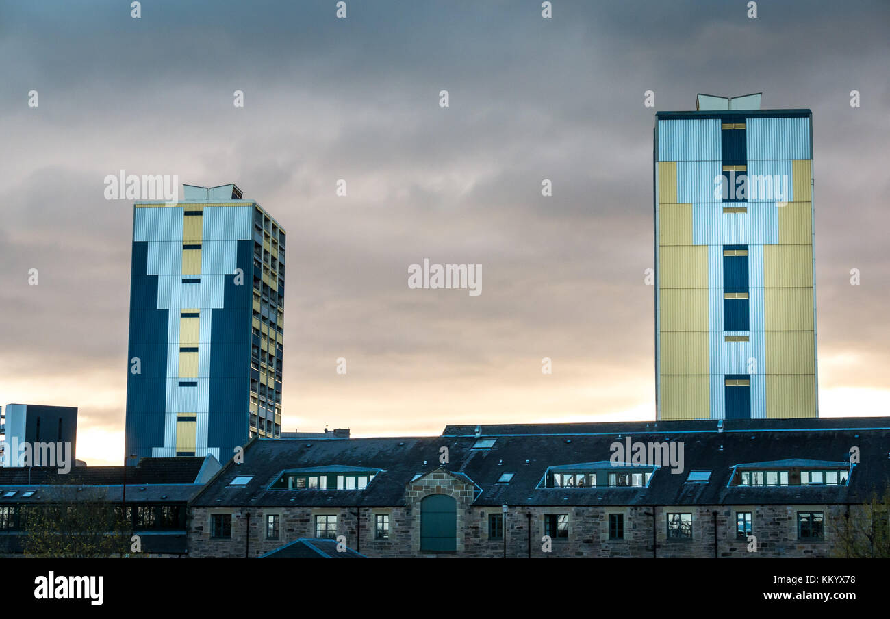 Council flats, social housing tower blocks, Couper Street, against dark cloudy sky, Leith, Edinburgh, Scotland, UK Stock Photo