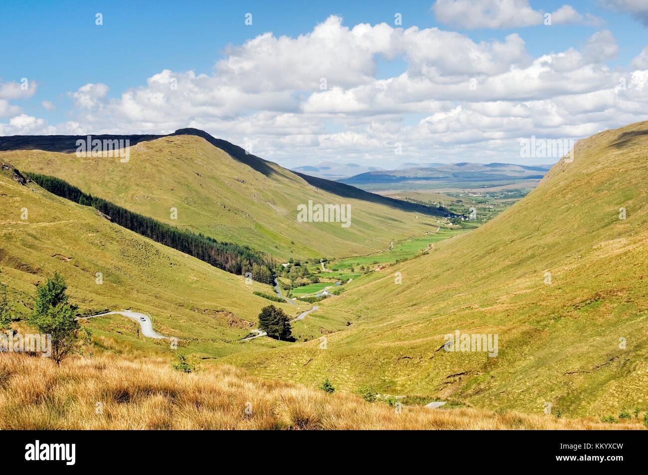 The mountain road from Glengesh Pass leads northeast toward the town of Ardara, County Donegal, Ireland. Stock Photo