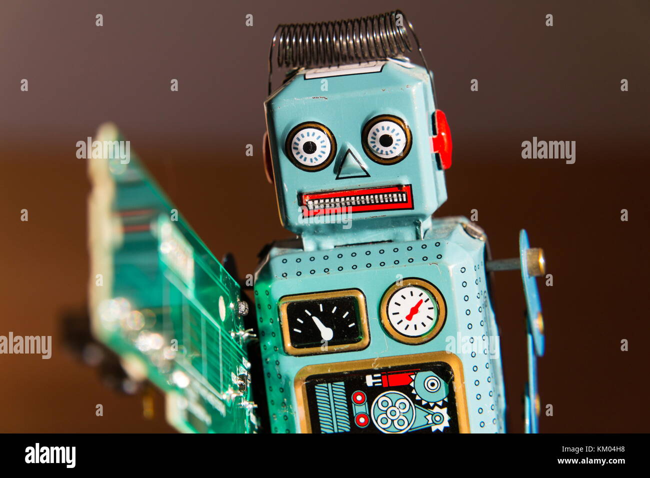 Computer Robot Toy Tin toy robot carries computer circuit board, artificial intelligence ...