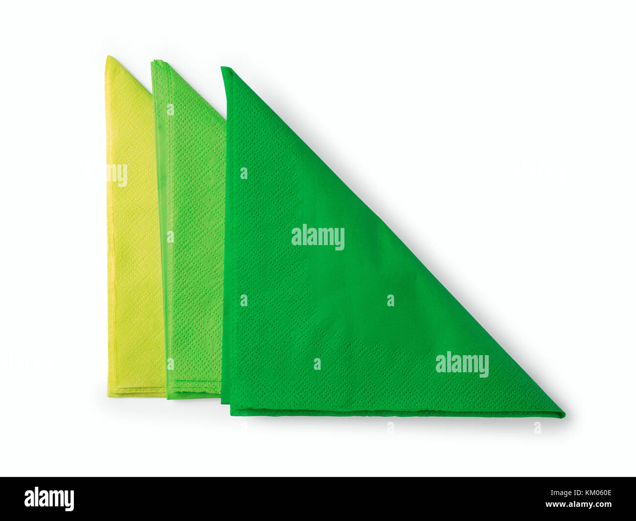 Three green folded paper napkins. Isolated on white, clipping path included Stock Photo