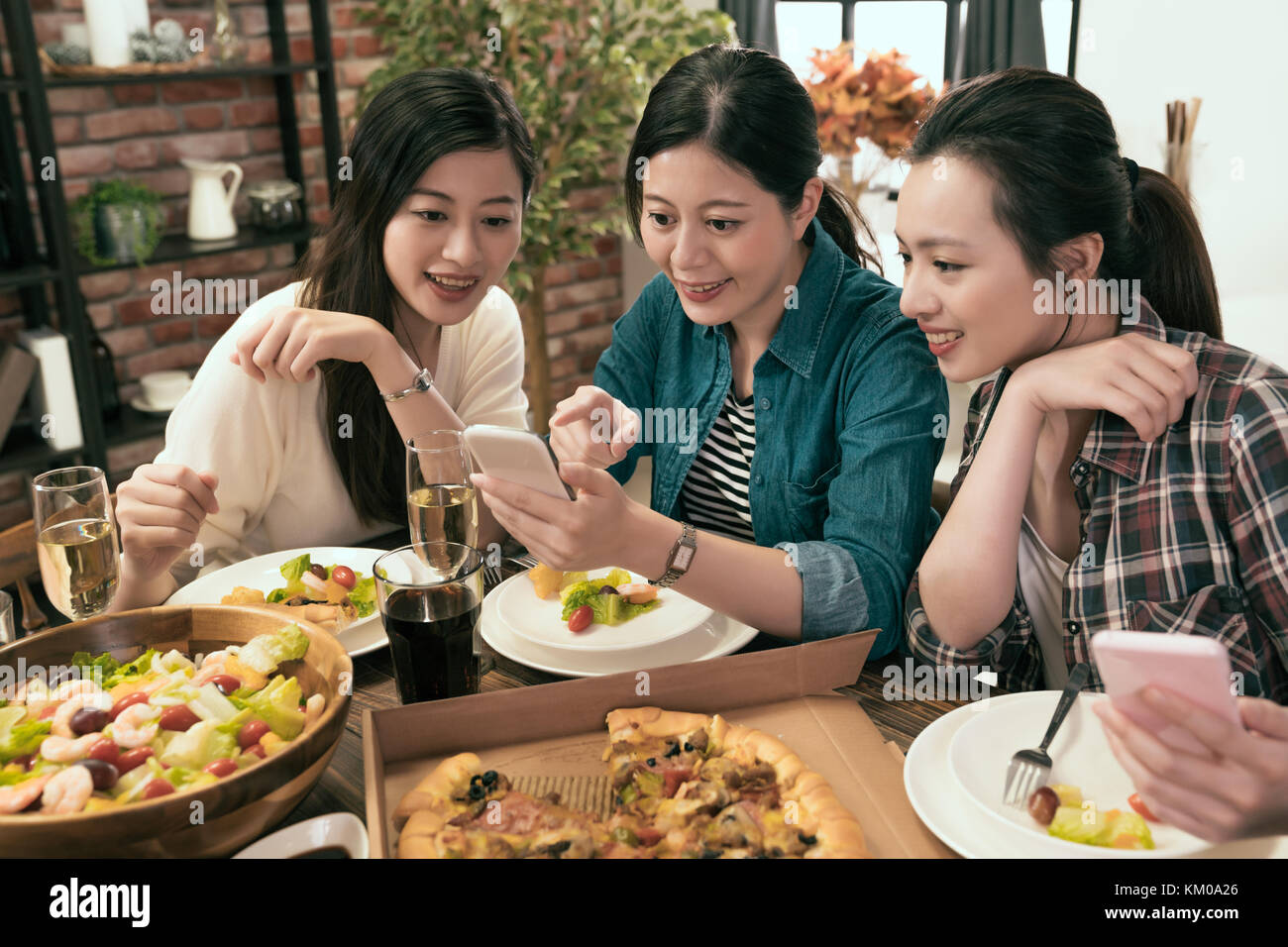 happy friends with smart phones taking food picture and shopping online at home Stock Photo