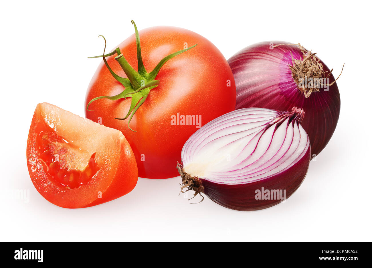 Whole fresh red tomato with green leaf and slice near unpeeled red onion and half isolated on white background Stock Photo