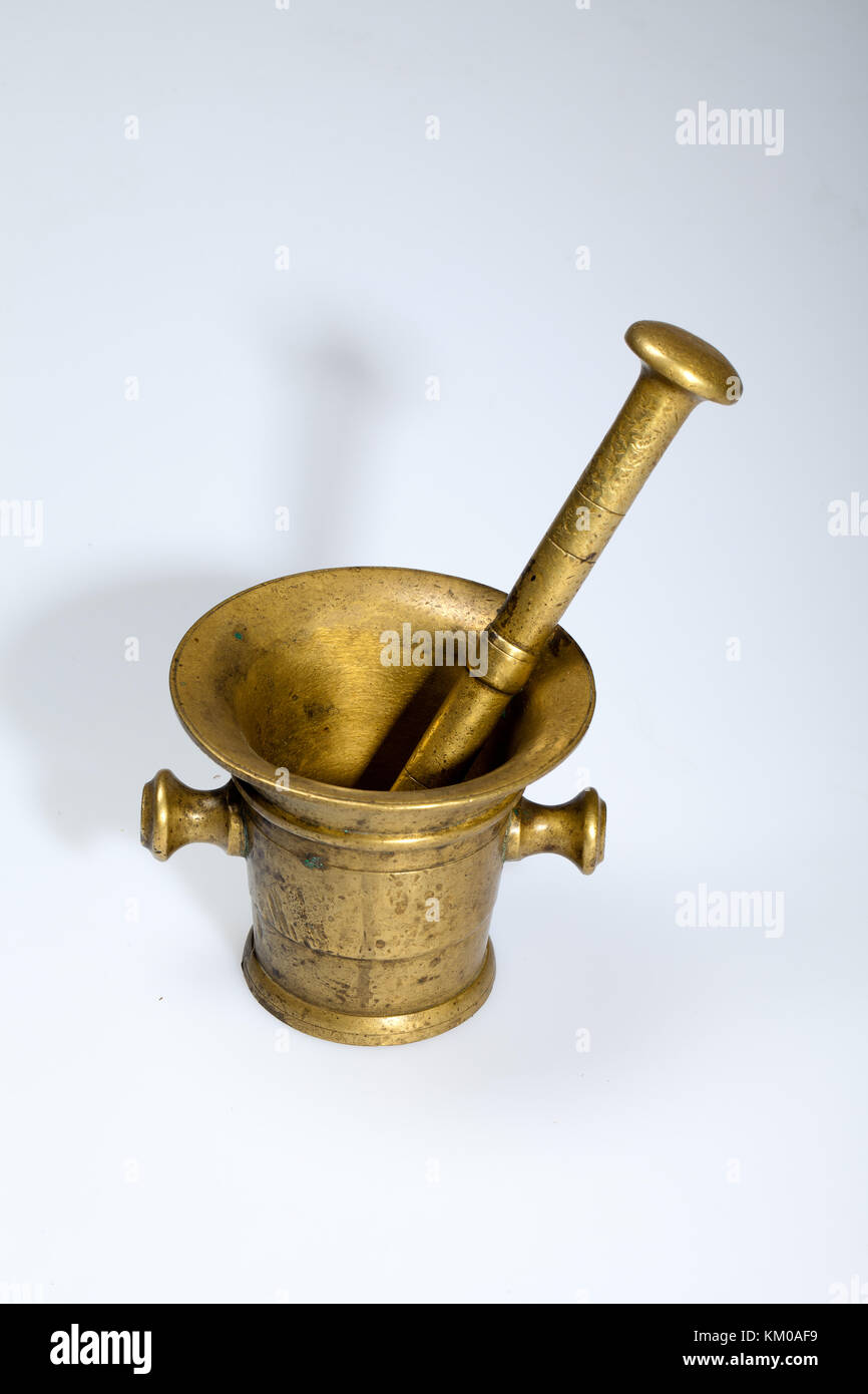 brass mortar and pestle isolated on white Stock Photo Alamy