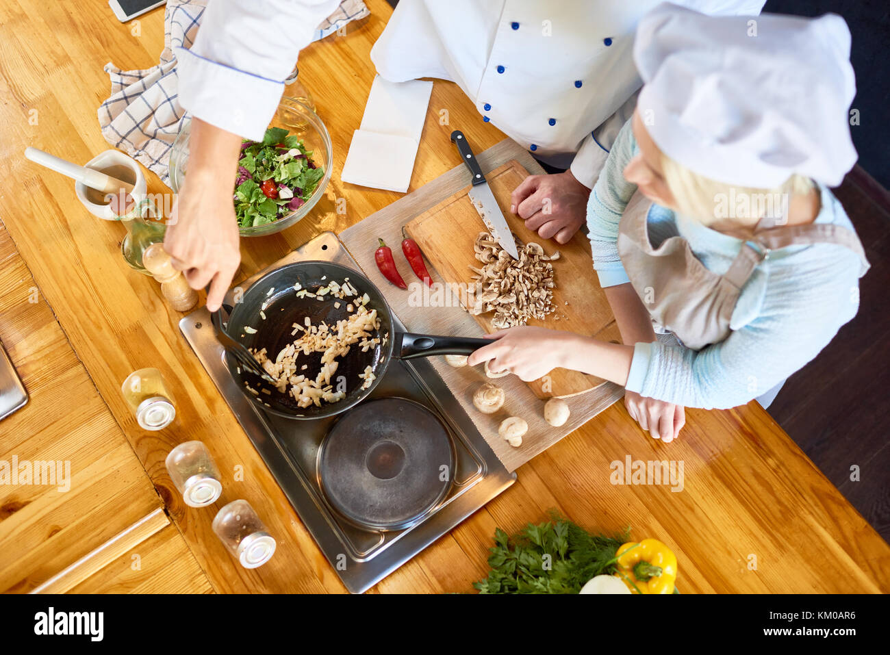 Teamwork at Modern Restaurant Kitchen Stock Photo