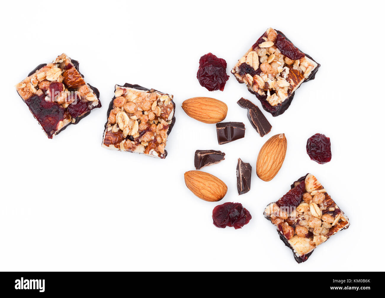Cereal bar with almonds and cranberries chocolate on white background