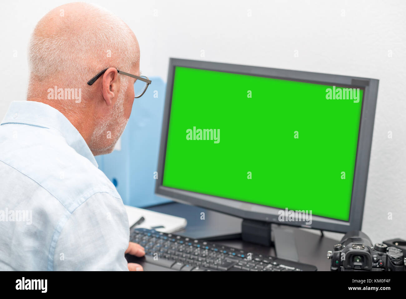 Man With Glasses Using Computer a mature businessman with glasses using computer Stock Photo - Alamy