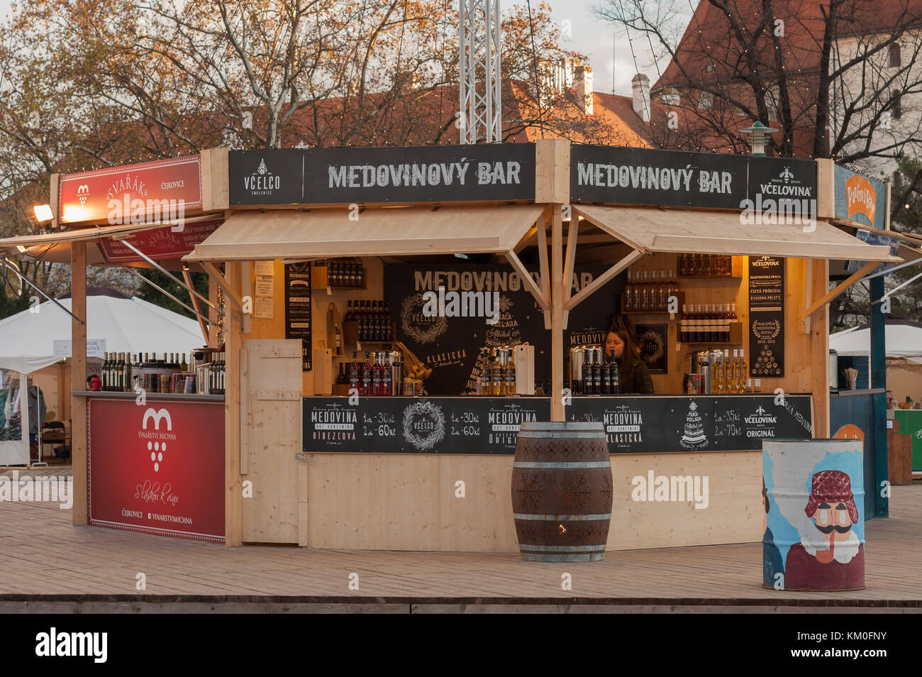 Brno,Czech Republic-November 27,2017: Saleswoman in stall with bee products at Christmas market at Moravian Square on November  27, 2017 Brno, Czech Stock Photo