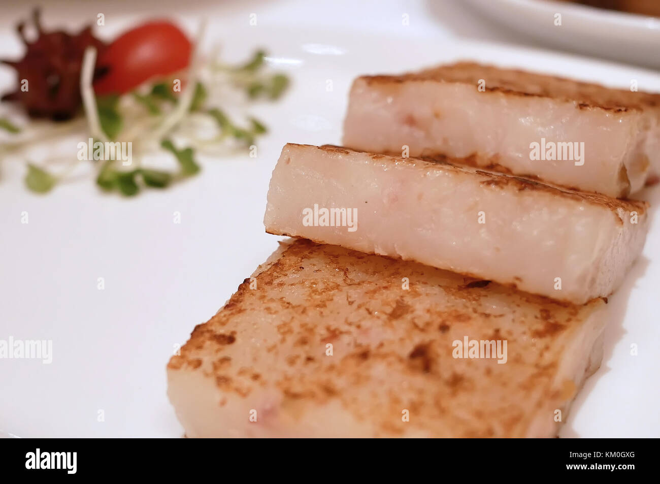 Close up of pan fried turnip cake dim sum on table Stock Photo Alamy