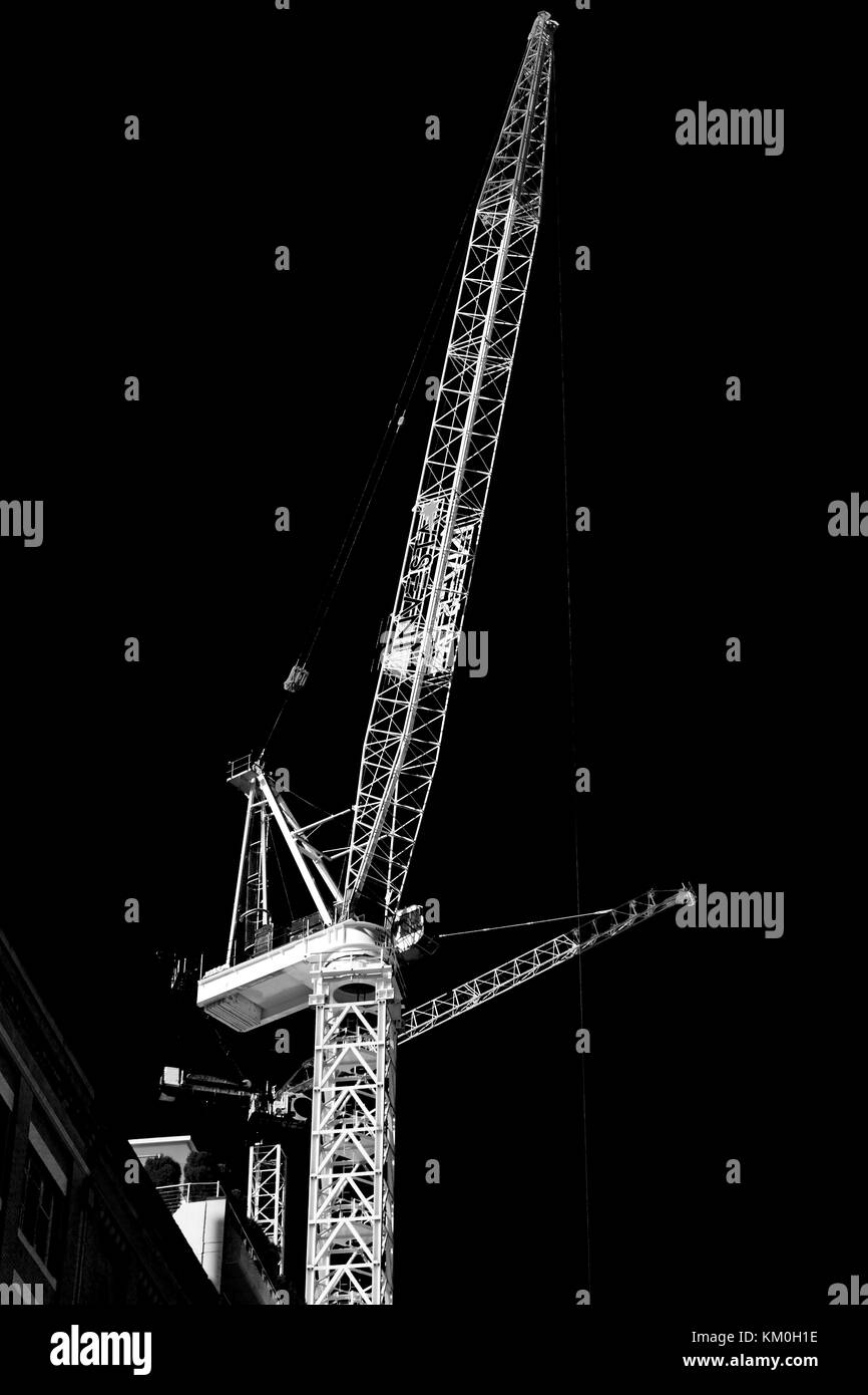 Mobile crane lifting steel frame Black and White Stock Photos & Images ...
