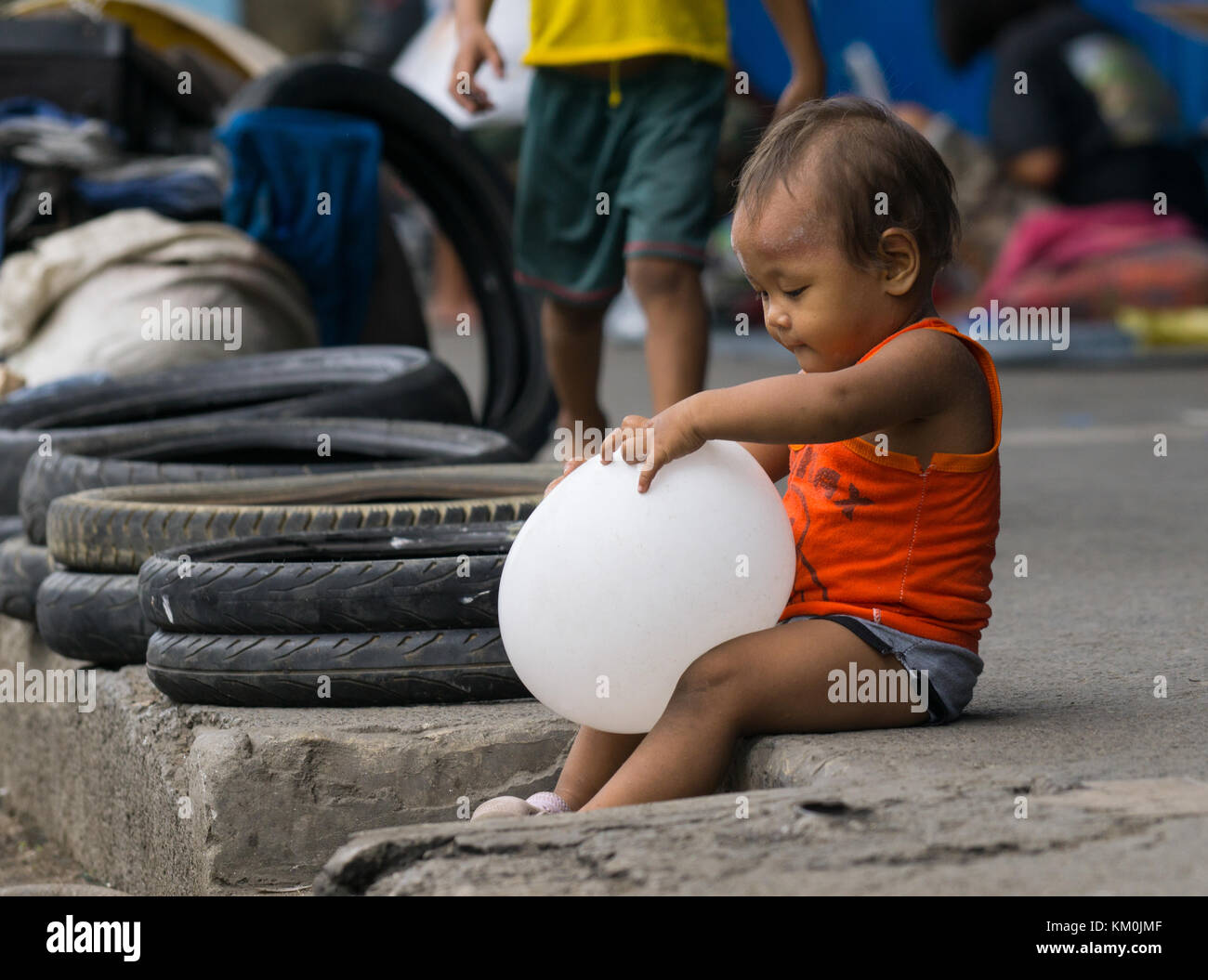 A Filipino street child within the downtown area of Cebu City,Philippines. Stock Photo