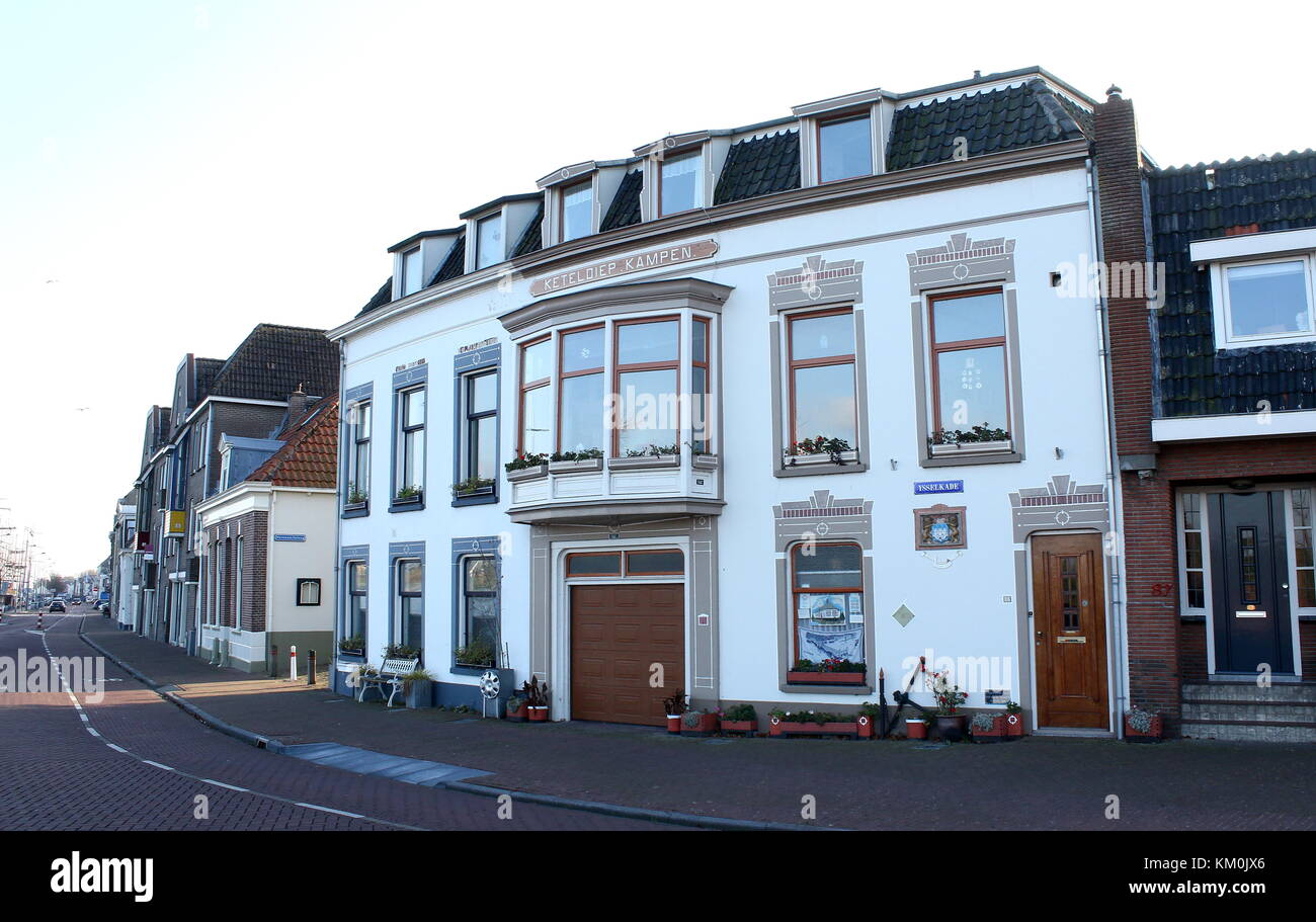 Houses along IJsselkade quay on the IJssel river, inner city of Kampen, The Netherlands Stock Photo