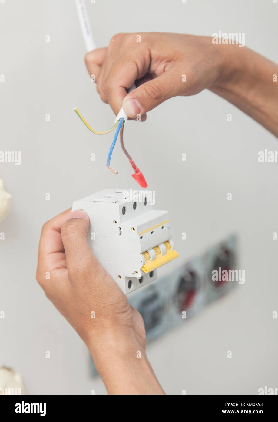 An electrician working on a power socket/plug during house renovations