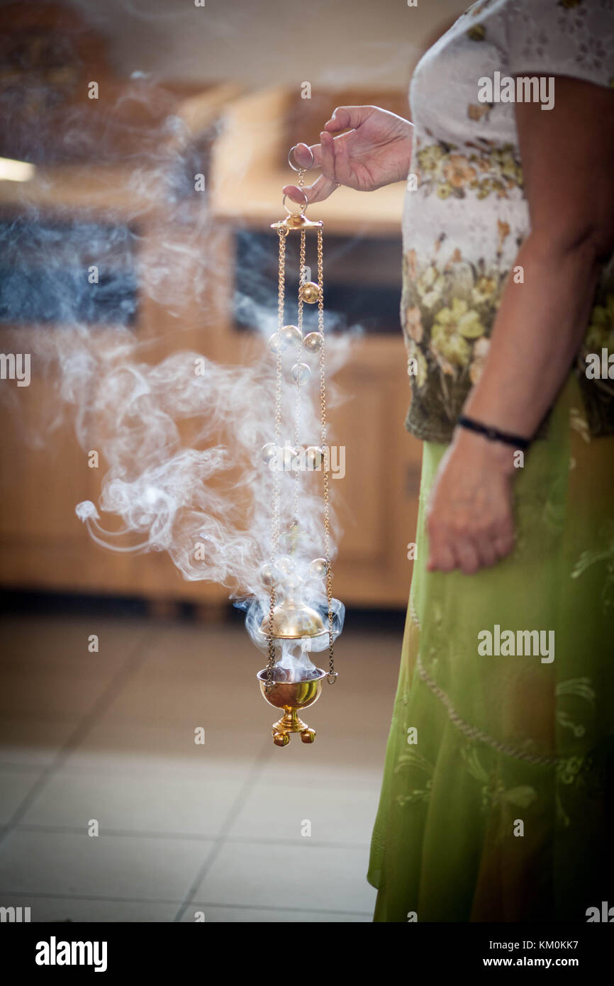 Woman holding burning incense hi-res stock photography and images - Alamy