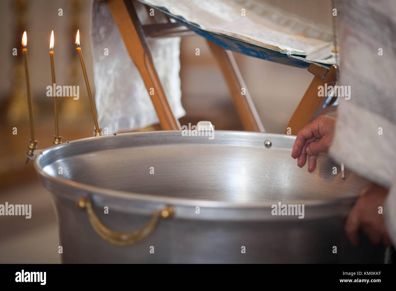 Orthodox baptism bowl of holy water and candles Stock Photo Alamy