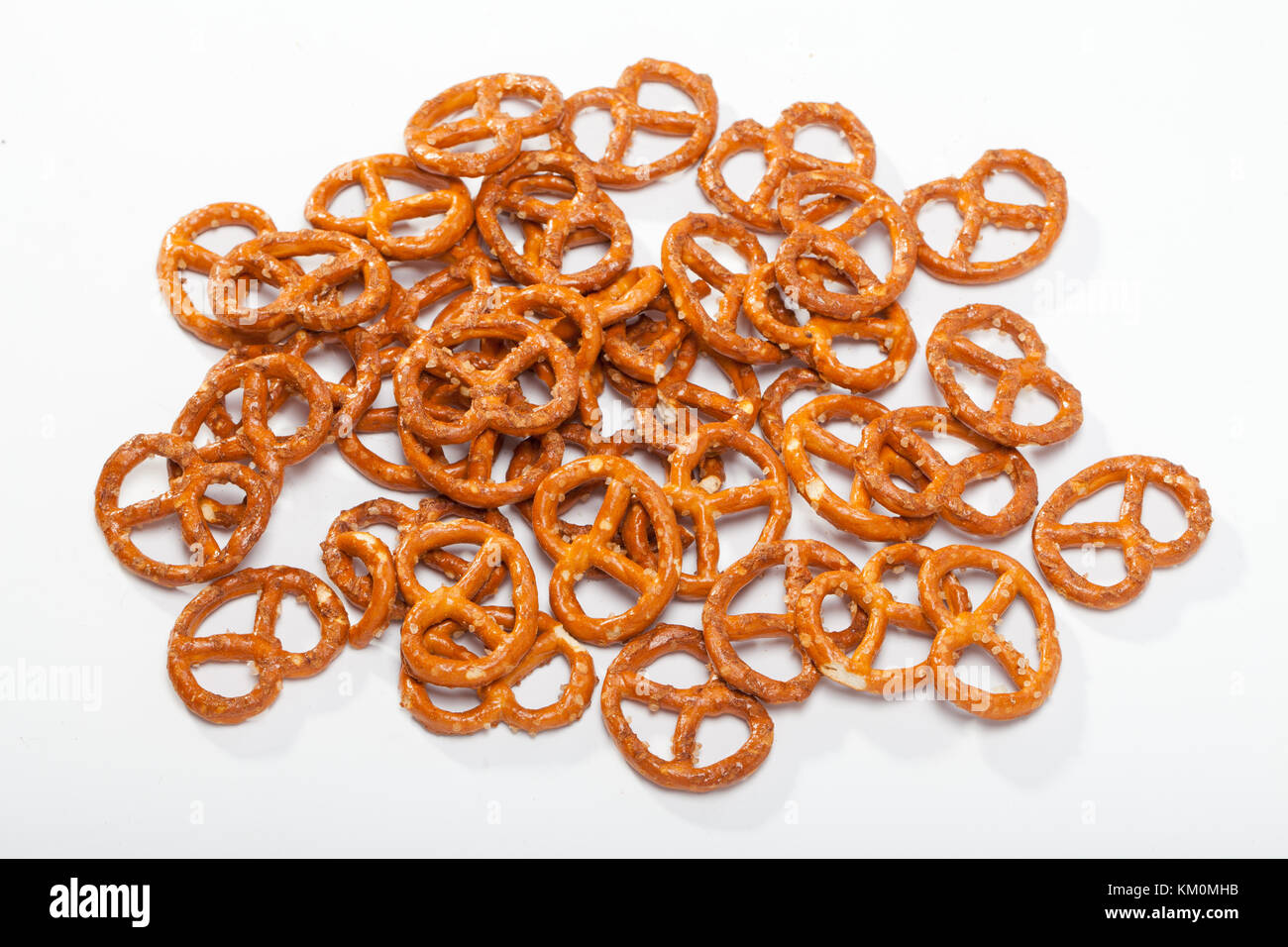 salted pretzels on white background Stock Photo Alamy