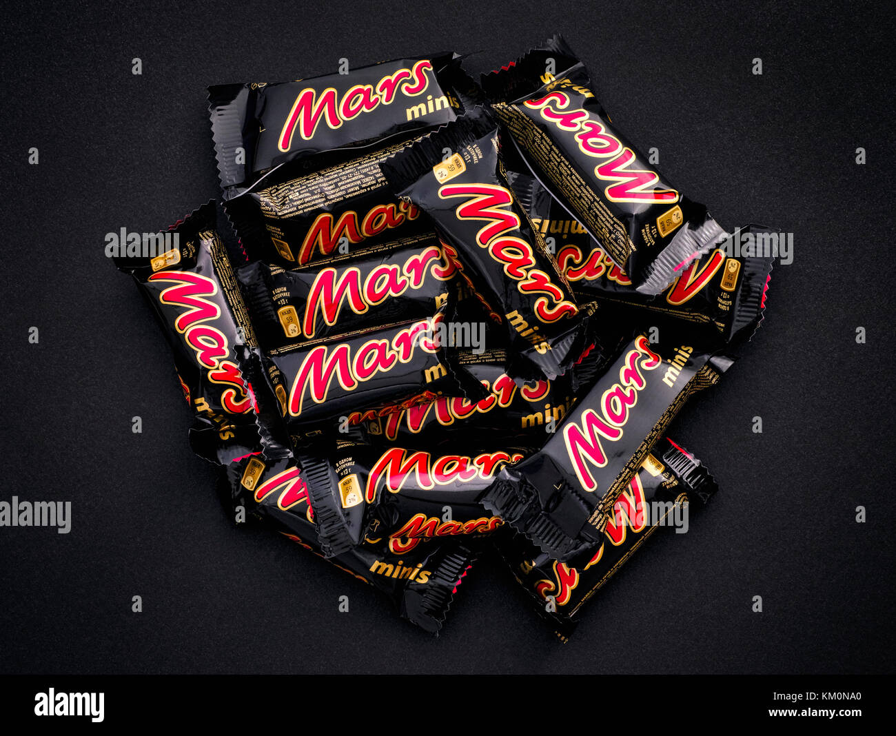 Tambov, Russian Federation - November 15, 2017 Heap of Mars minis candy bars on black background. Studio shot. Stock Photo
