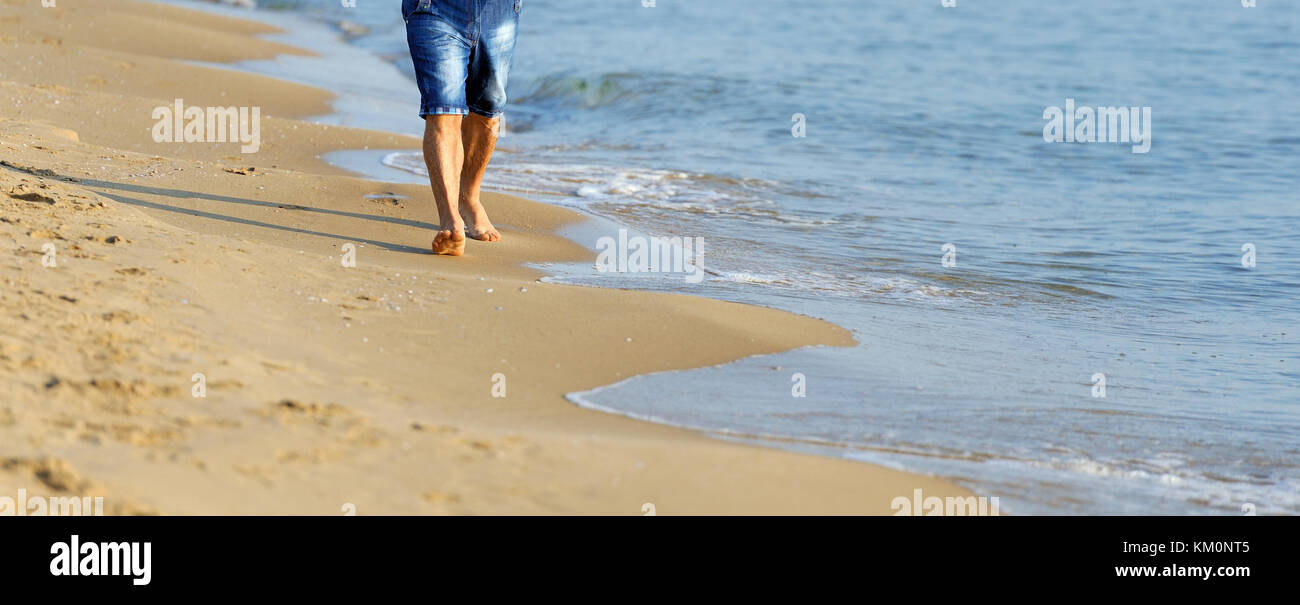 Male feet walking on sand hi-res stock photography and images - Alamy