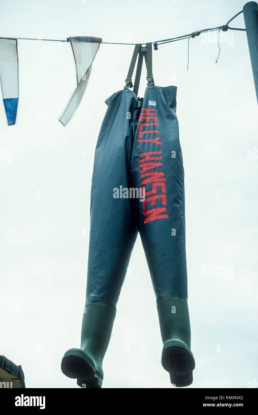 Waders hanging up to dry on washing line Stock Photo Alamy