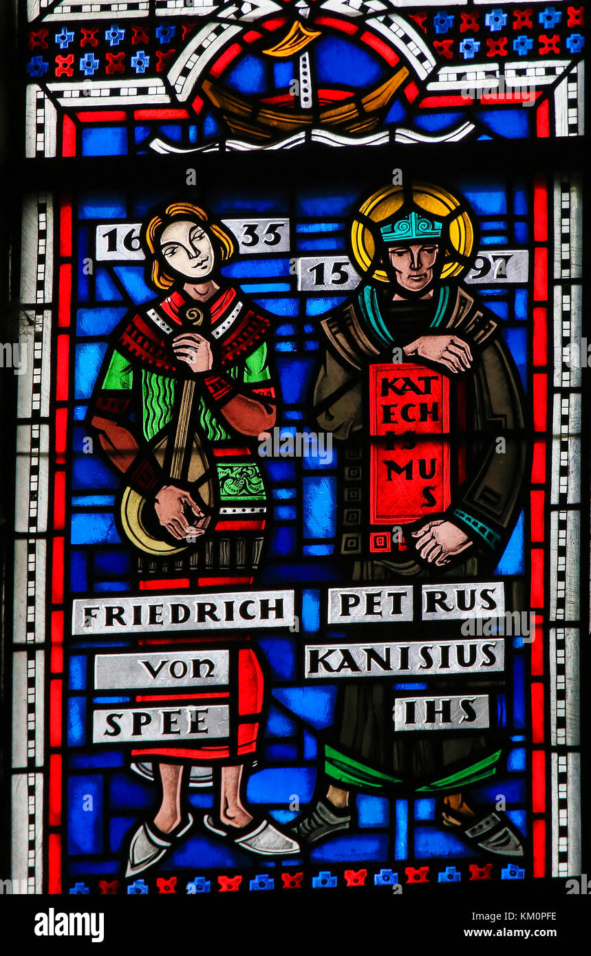 Stained Glass in Wormser Dom in Worms, Germany, depicting Friedrich Spee and Petrus Kanisiuis or Peter Canisius, famous Jesuit priests during the Cont Stock Photo
