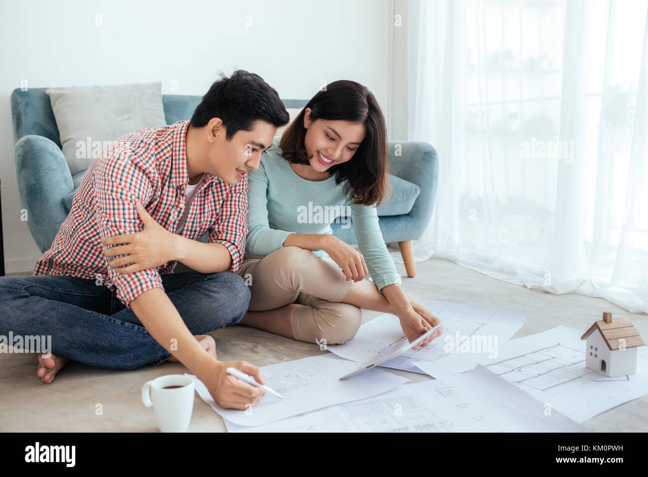 The couple are discussing house plans of the dream home. Family happiness. Stock Photo