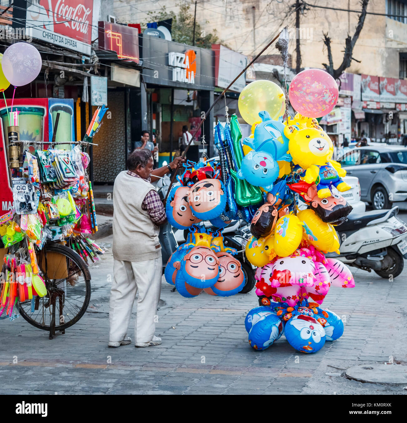 Street seller selling colourful helium balloons in Amritsar, a city in north-western India in the Majha region of the Indian state of Punjab Stock Photo