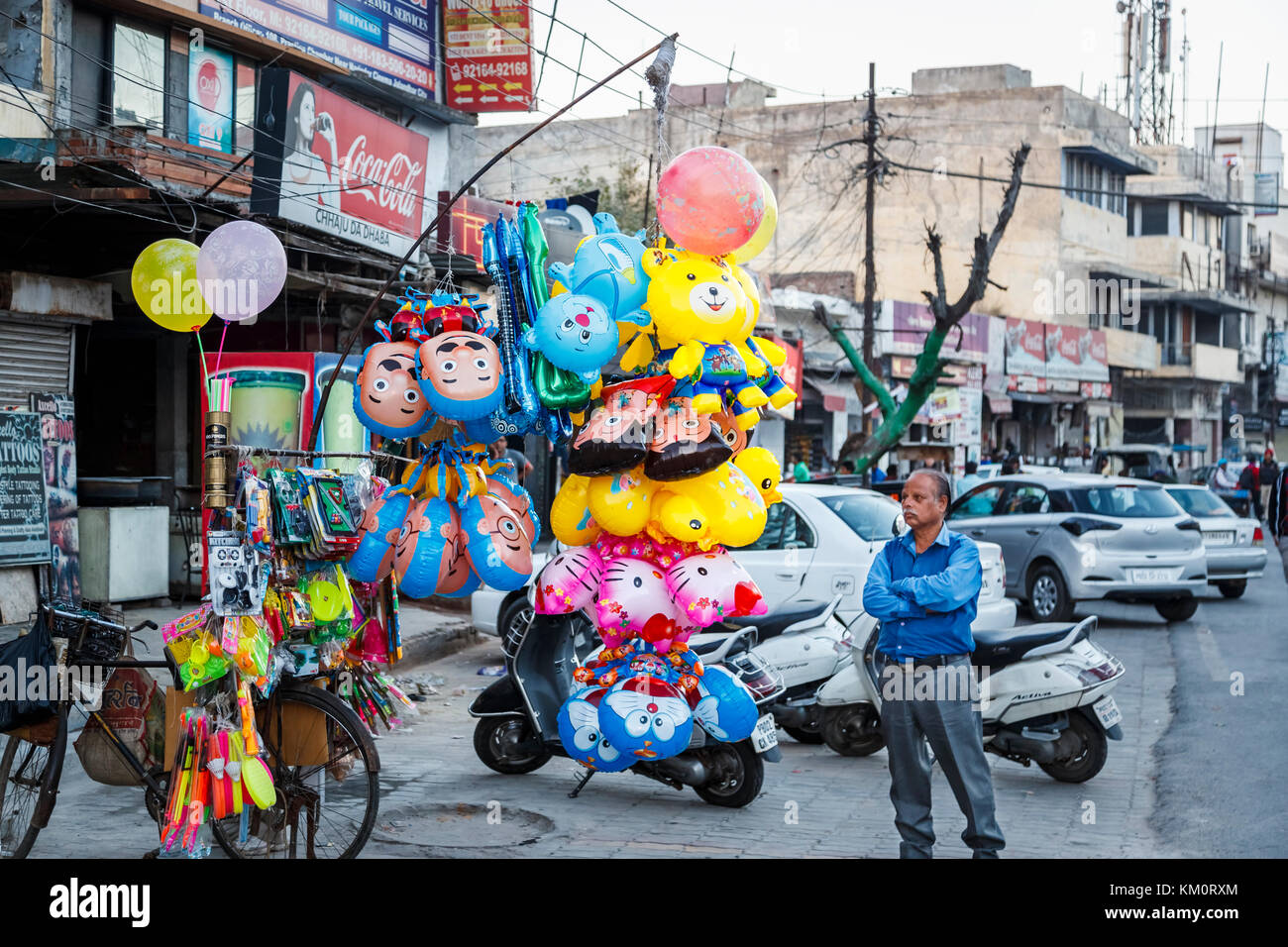 Street seller selling colourful helium balloons in Amritsar, a city in north-western India in the Majha region of the Indian state of Punjab Stock Photo