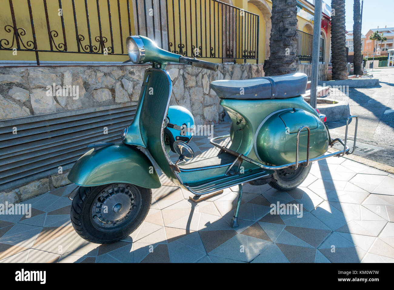 Classic green Vespa 150 super parked in Spanish street Stock Photo