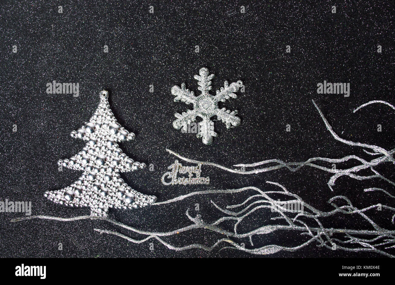 Silver Christmas decorations on shiny dark background Stock Photo