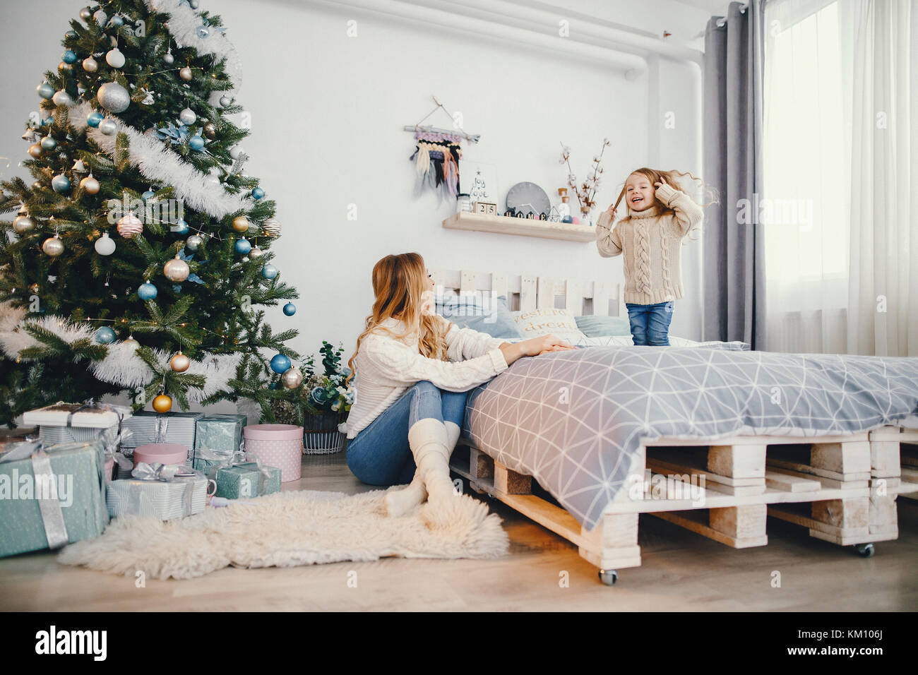 baby girl jumping on the bed Stock Photo Alamy