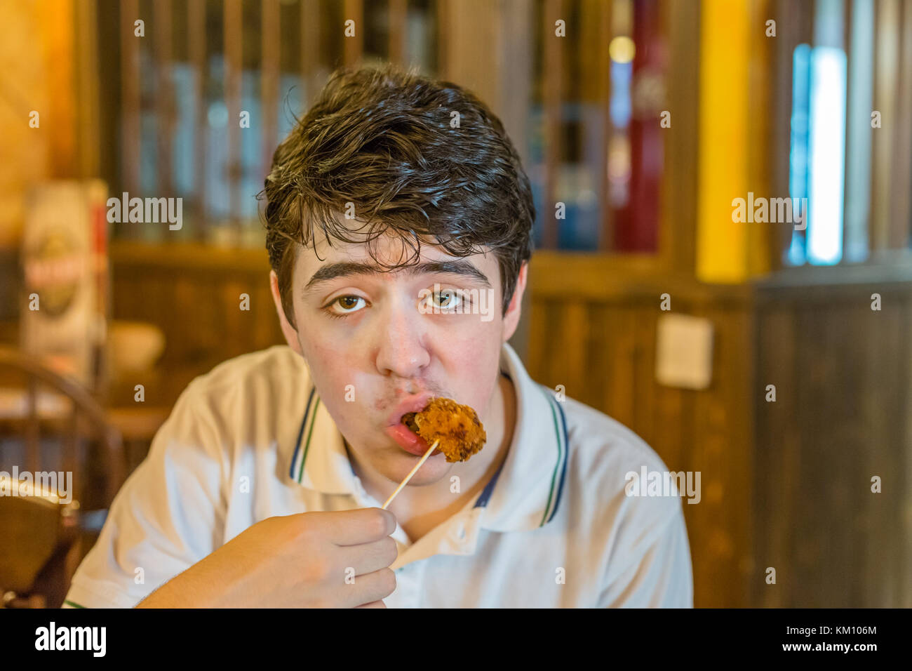 boy with acne skin eating unhealthy fried food Stock Photo Alamy