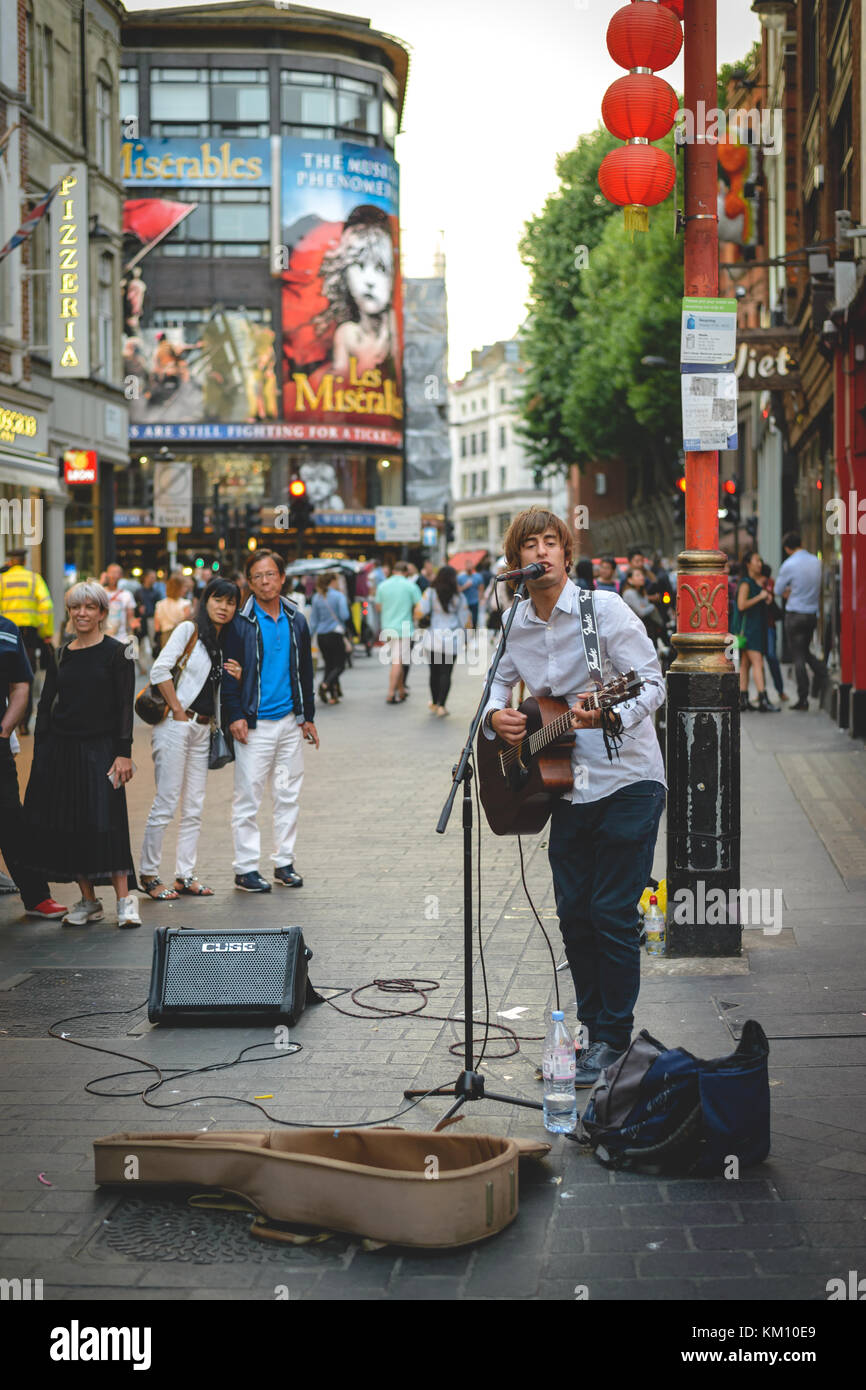Street musician performing in Chinatown in London (UK). July 2017. Portrait format. Stock Photo